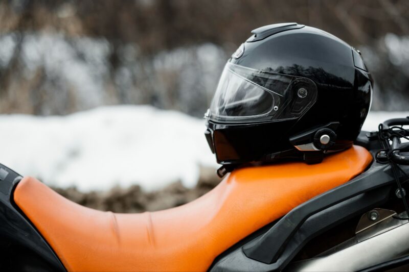 Close up motorcycle seat with helmet on it